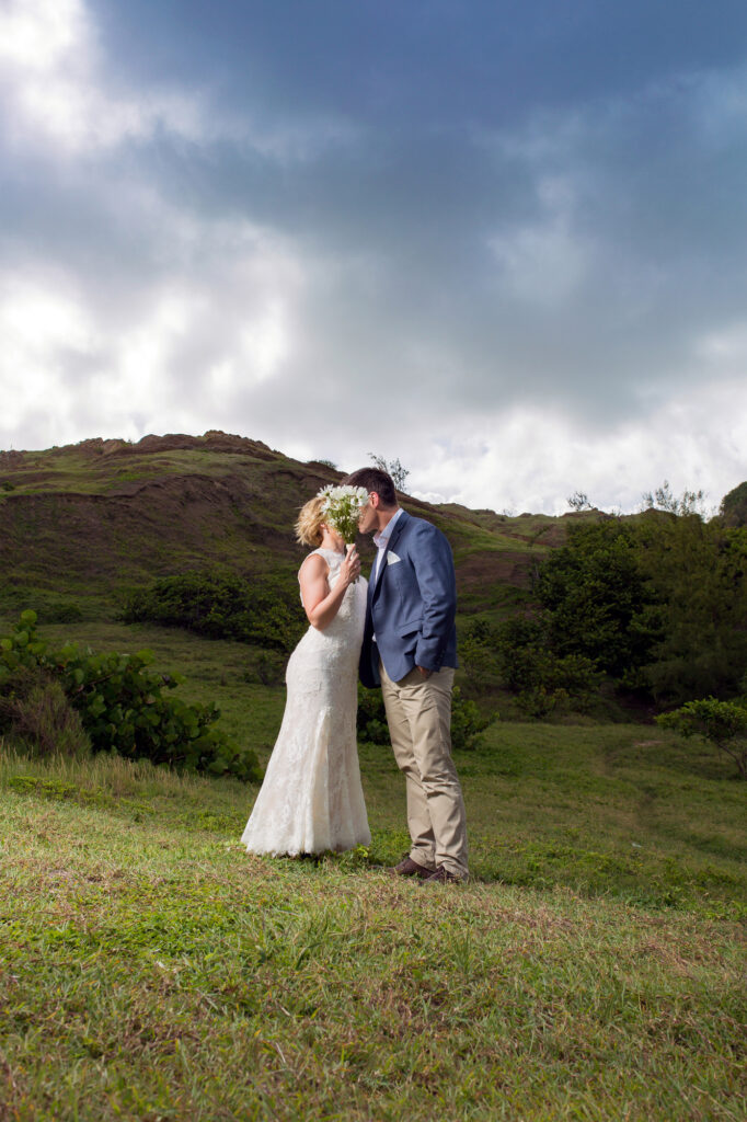 Elopement couple kissing in the hills. 