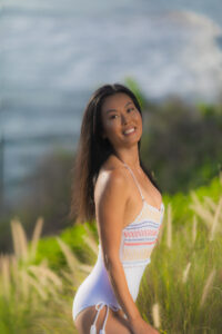 Woman in bathing suit by the seaside